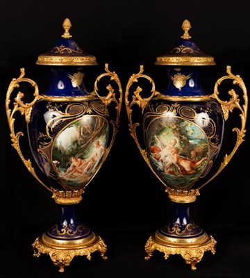 Lot 992 - A pair of large decorative porcelain urns with...