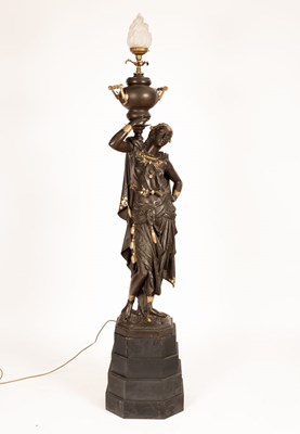 Lot 999 - A spelter figural floor lamp modelled as a...