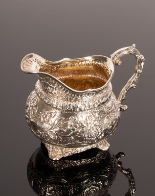 Lot 47 - A George III silver and silver gilt jug,...