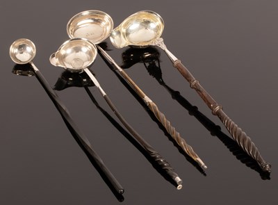 Lot 57 - Four silver toddy ladles of various sizes and...