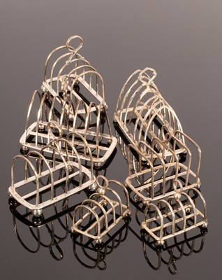 Lot 70 - Three pairs of silver toast racks, Victorian...