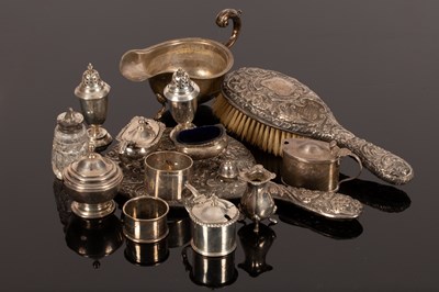 Lot 100 - A quantity of silver to include a sauce boat,...