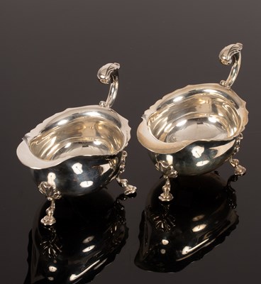 Lot 129 - A pair of 18th Century style silver sauce...