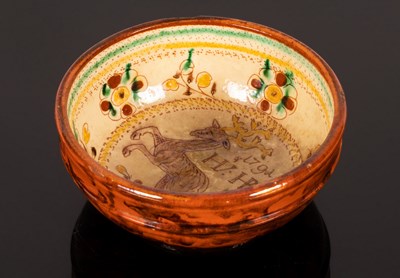 Lot 185 - A small glazed bowl, the interior decorated a...