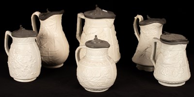 Lot 191 - Six saltware jugs, various patterns, pewter...