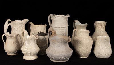 Lot 194 - Eleven saltware jugs, various patterns, one...