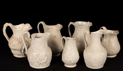 Lot 201 - Fifteen saltware jugs, various patterns, the...