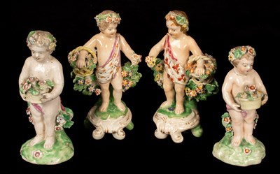 Lot 203 - A Derby pair of cherubs with flower baskets,...