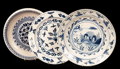 Lot 236 - Three delftware blue and white chargers, 33cm...