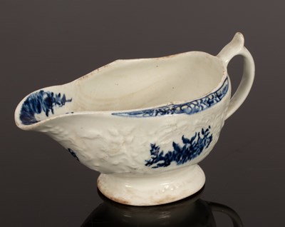 Lot 240 - A Lowestoft sauce boat, circa 1760-70, moulded...