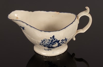 Lot 243 - A Caughley sauce boat, circa 1780, the moulded...