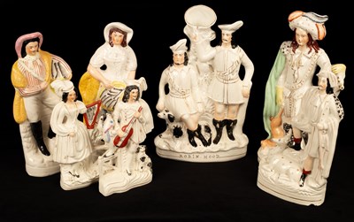 Lot 252 - A collection of Staffordshire figures,...