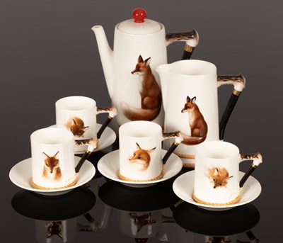 Lot 284 - A Royal Doulton coffee set, each piece...