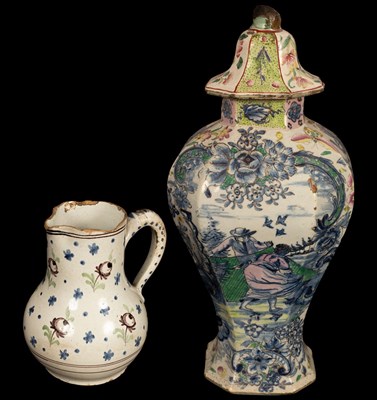 Lot 287 - A clobbered Delft baluster vase and cover,...