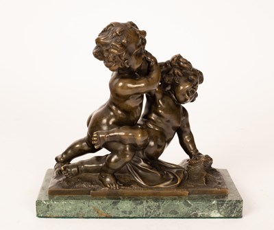 Lot 324 - A figure depicting putti, bronze, 23cm high