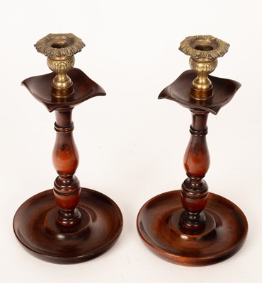 Lot 353 - A pair of turned wood candlesticks, 28cm high