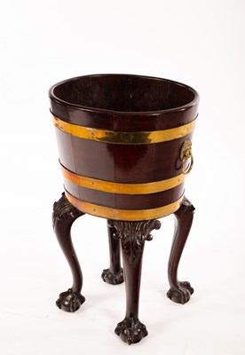 Lot 392 - A George III mahogany and brass bound bucket,...