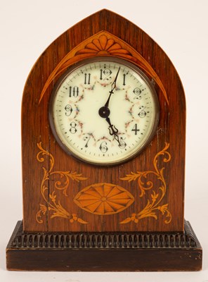 Lot 440 - An Edwardian inlaid arch cased mantel clock,...