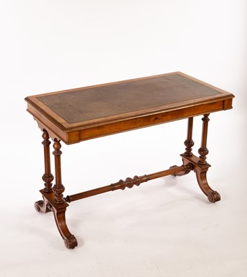 Lot 603 - A Victorian walnut writing table on twin-end...