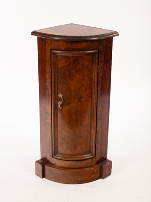 Lot 617 - A narrow floor standing bowfronted corner...