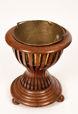 Lot 623 - An Edwardian waisted slatted jardinière stand...