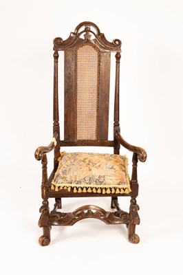 Lot 624 - A Carolean oak armchair with cane seat and back