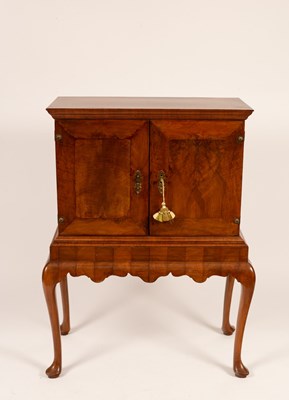 Lot 632 - A walnut cabinet on stand fitted interior with...