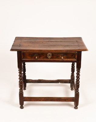 Lot 639 - A late 17th Century elm table fitted a drawer...