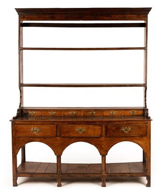 Lot 642 - An 18th Century oak dresser with shelves over,...