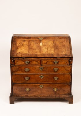 Lot 644 - An 18th Century walnut bureau with feather...