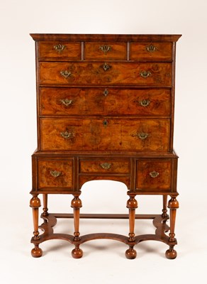 Lot 645 - A George II walnut chest of three long and...