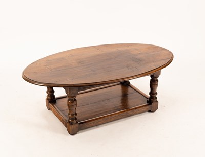 Lot 651 - An oval oak table with platform beneath, 49cm...