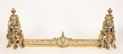 Lot 652 - A brass fender with winged griffin supports...