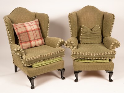 Lot 653 - A pair of wingback armchairs on dwarf cabriole...