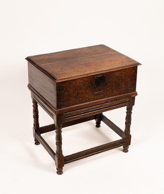 Lot 658 - An 18th Century carved oak bible box on a...