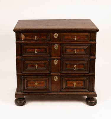 Lot 668 - A Jacobean style oak chest of four long...