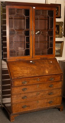 Lot 676 - A George III bureau bookcase, the bookcase...