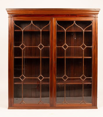 Lot 683 - A mahogany bookcase with moulded cornice,...