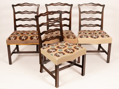 Lot 690 - Four pierced ladder back chairs with...