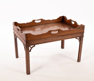 Lot 713 - A Victorian mahogany tray table with carved...