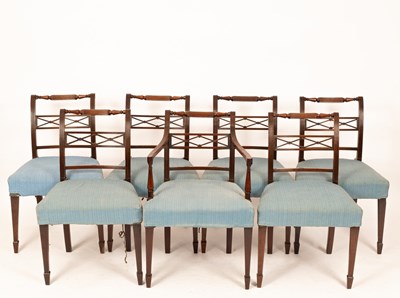 Lot 740 - A set of seven George III mahogany dining...