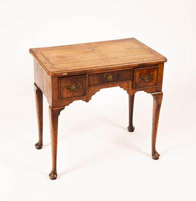 Lot 752 - A George I walnut three drawer side table,...