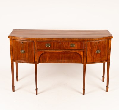 Lot 779 - A George III mahogany bowfront sideboard...