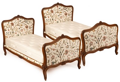 Lot 782 - A pair of French single beds, the carved...