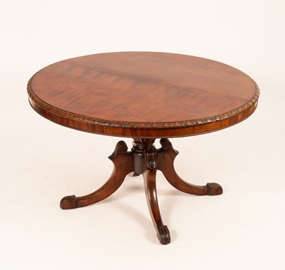 Lot 785 - A William IV circular tilt top table on carved...