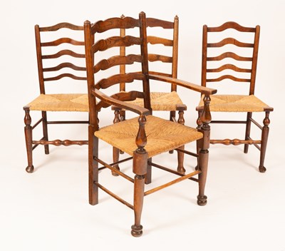 Lot 786 - Three matched country made ladder back chairs,...