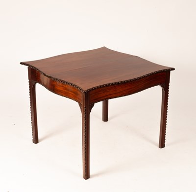 Lot 840 - A George III mahogany serpentine front tea...