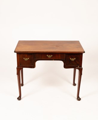 Lot 848 - A George III mahogany lowboy, the central...