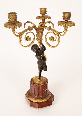 Lot 881 - A three-light gilt metal table light with...