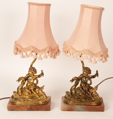 Lot 883 - A pair of gilt brass table lights each of a...